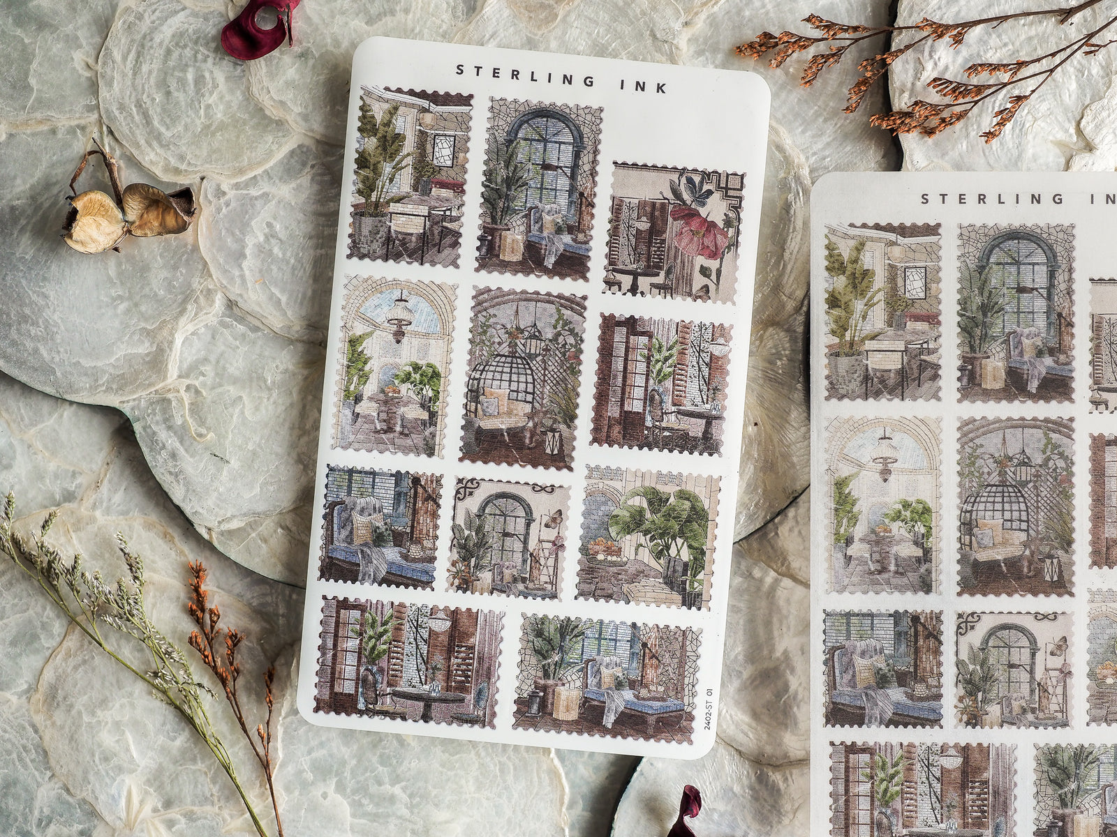 Grid pattern of antique, sepia-toned stickers featuring detailed Parisian window scenes, overgrown plants, and cozy European interiors for journaling.