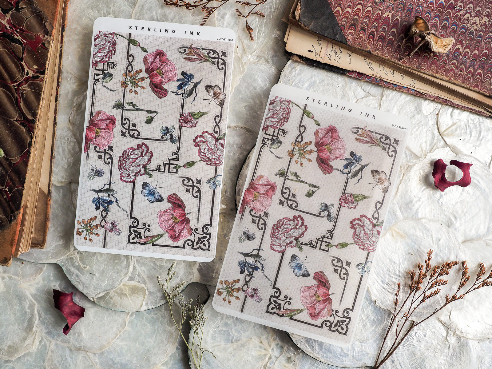 Decorative thin sticker strips featuring watercolor pink roses and delicate blue butterflies connected by black, ornate geometric vine patterns.