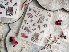 Delicate sticker sheet featuring vintage botanical illustrations in muted watercolor tones, including butterflies, potted plants, and miniature architectural elements.
