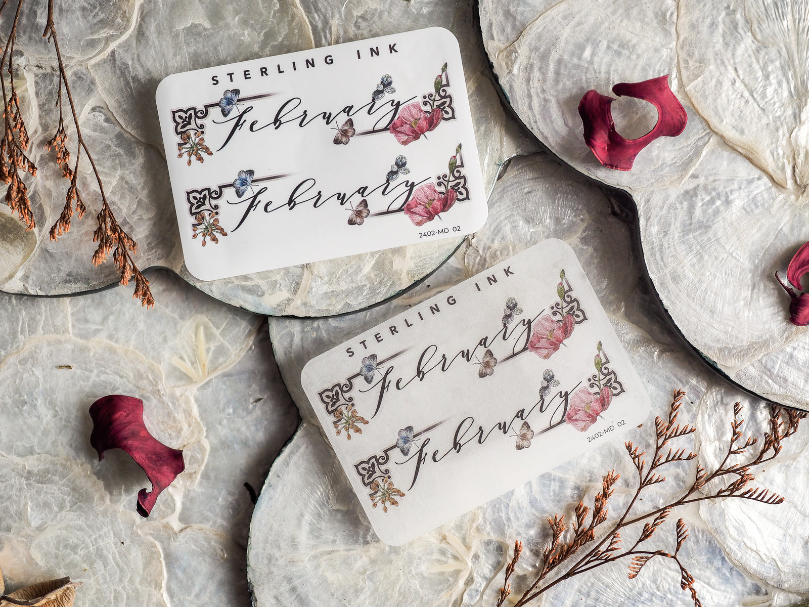 Ornate planner sticker set for February featuring delicate, scripted "February" lettering and detailed floral embellishments on an off-white background.