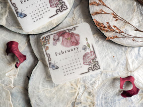 Elegant, printed sticker or mini planner for February 2024 featuring a soft, vintage floral wreath design with butterflies and script detailing.