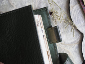 A set of coordinating planner tabs featuring January through December, designed for journaling and organization, with a subtle green and white aesthetic.