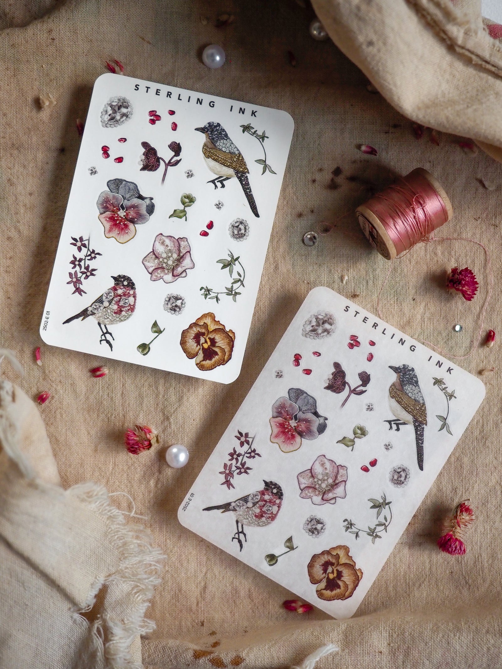 Botanical "Elements Stickers" featuring vintage illustrations of various blooming flowers, delicate berries, and detailed woodland birds printed on crisp white sticker paper.