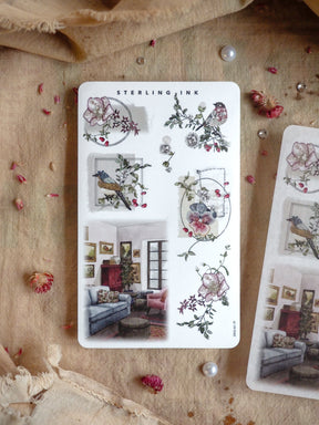 Vintage botanical sticker sheet featuring floral wreaths, clustered roses, and charming vignettes of cozy interior room decor for crafting.