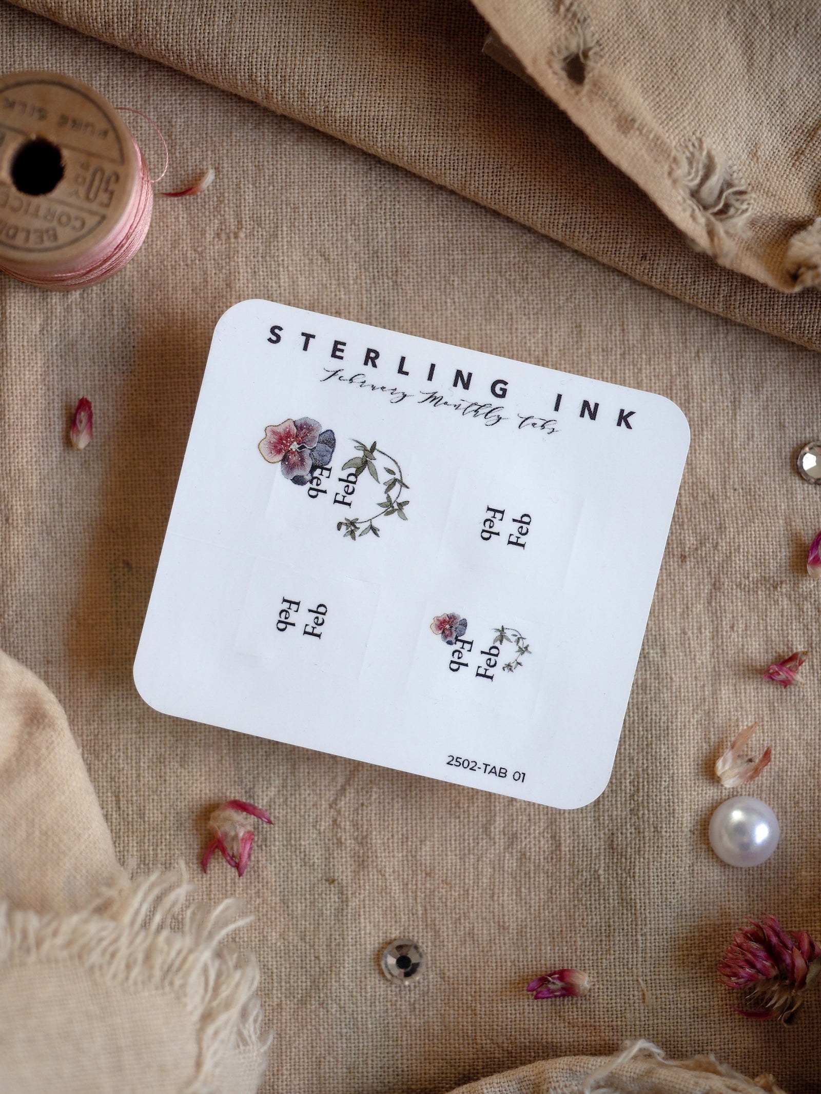Decorative monthly tab set for February 2025, featuring delicate botanical illustrations and pale, romantic floral designs perfect for journaling or planning.