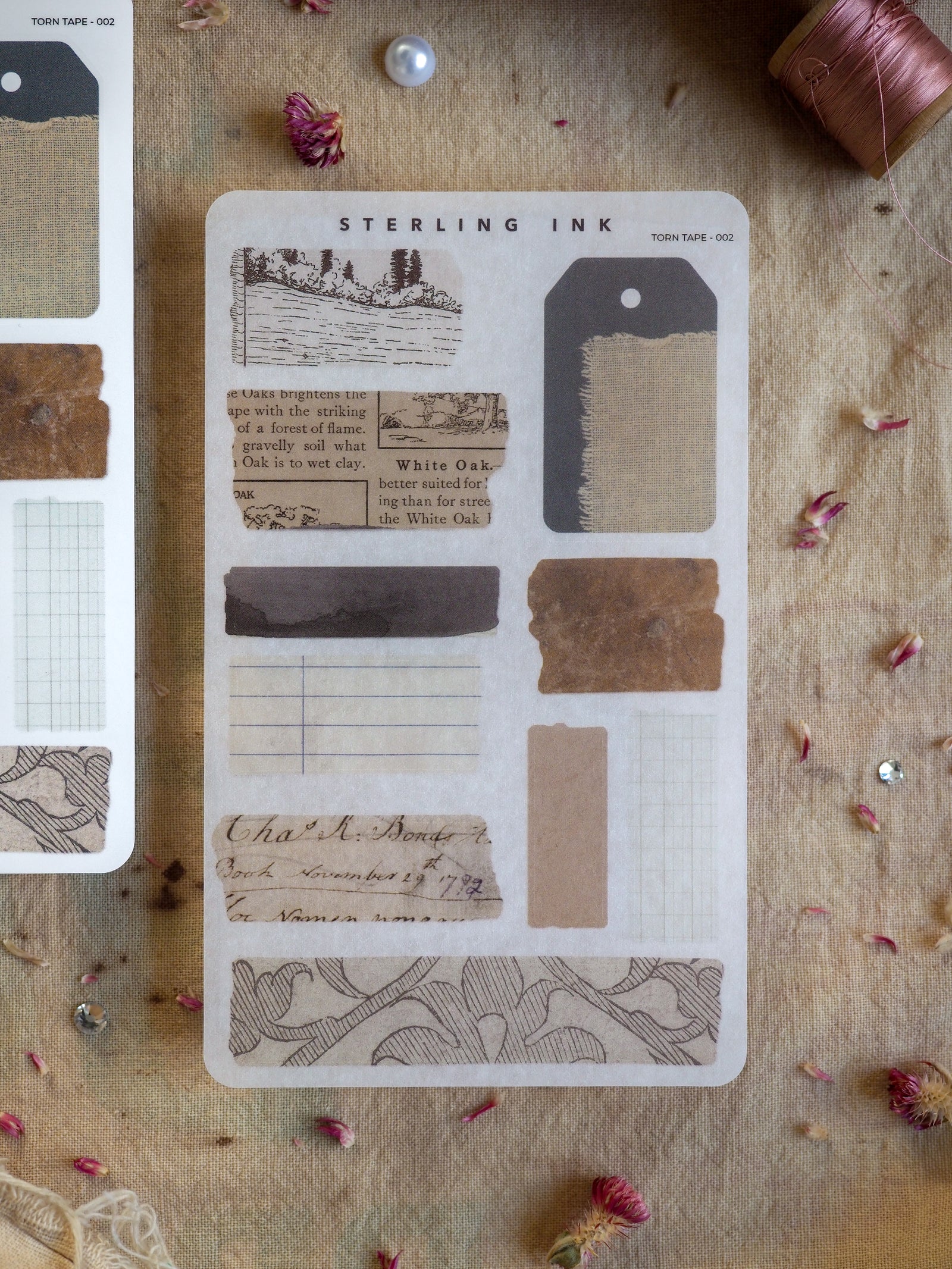 Vintage "Torn Tape" sticker set featuring rustic, historical designs like oak leaf sketches, ruled journal paper, and aged labels for scrapbooking and journaling.