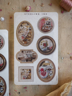 Beautiful sticker set featuring various vintage picture frames with distressed gold accents and nostalgic interior vignettes, perfect for scrapbooking.