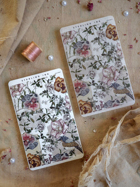 Detailed watercolor sticker strips featuring romantic floral patterns in shades of dusty rose, slate blue, and lush green foliage.