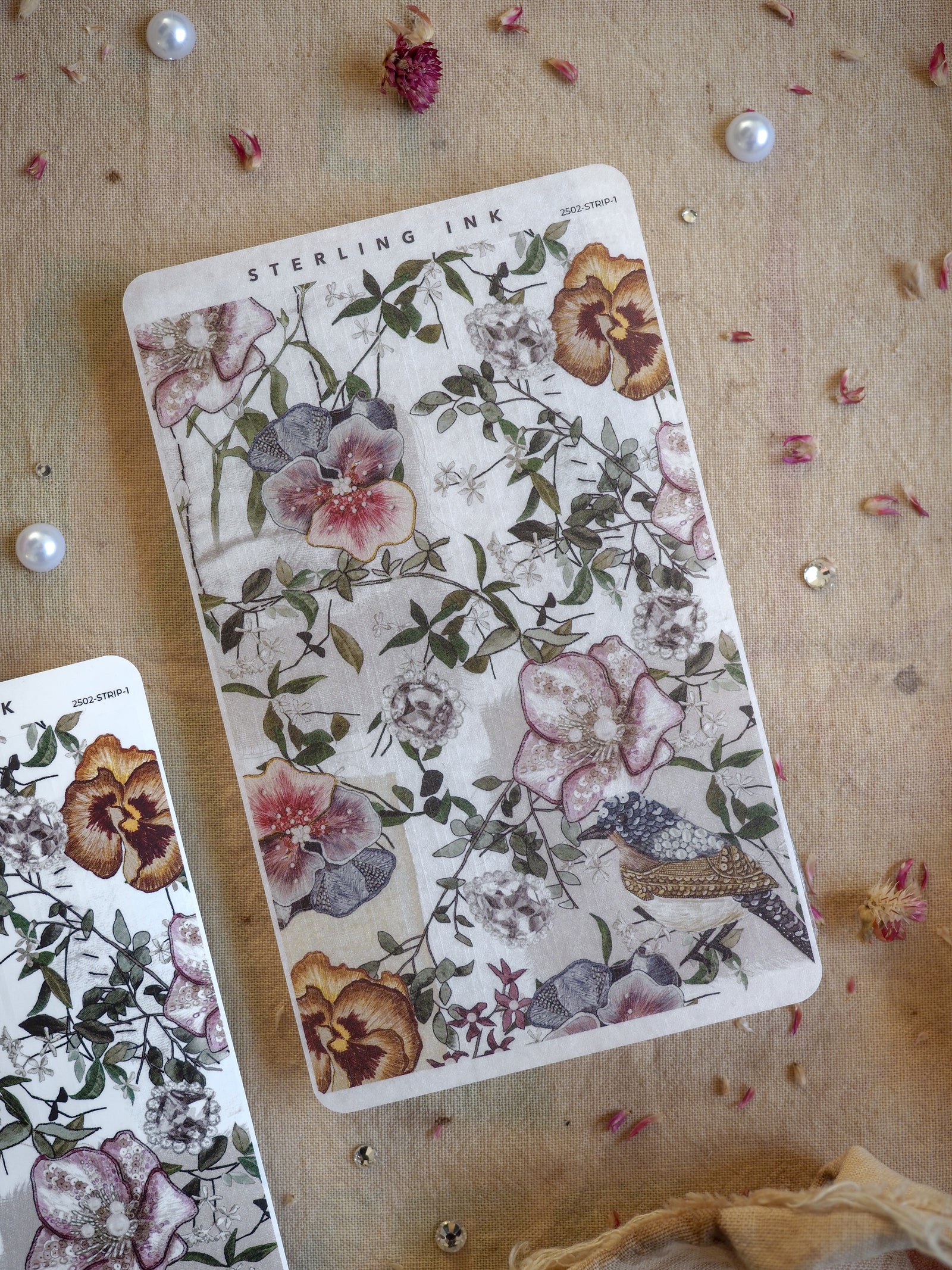 Watercolor floral sticker sheet featuring muted pink and brown blooms, delicate greenery, and a charming bird motif, perfect for journaling decor.
