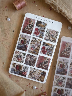 Decorative vintage stamp stickers forming a grid pattern with rich red trim and cream-toned vignettes, ideal for scrapbooking and planning.