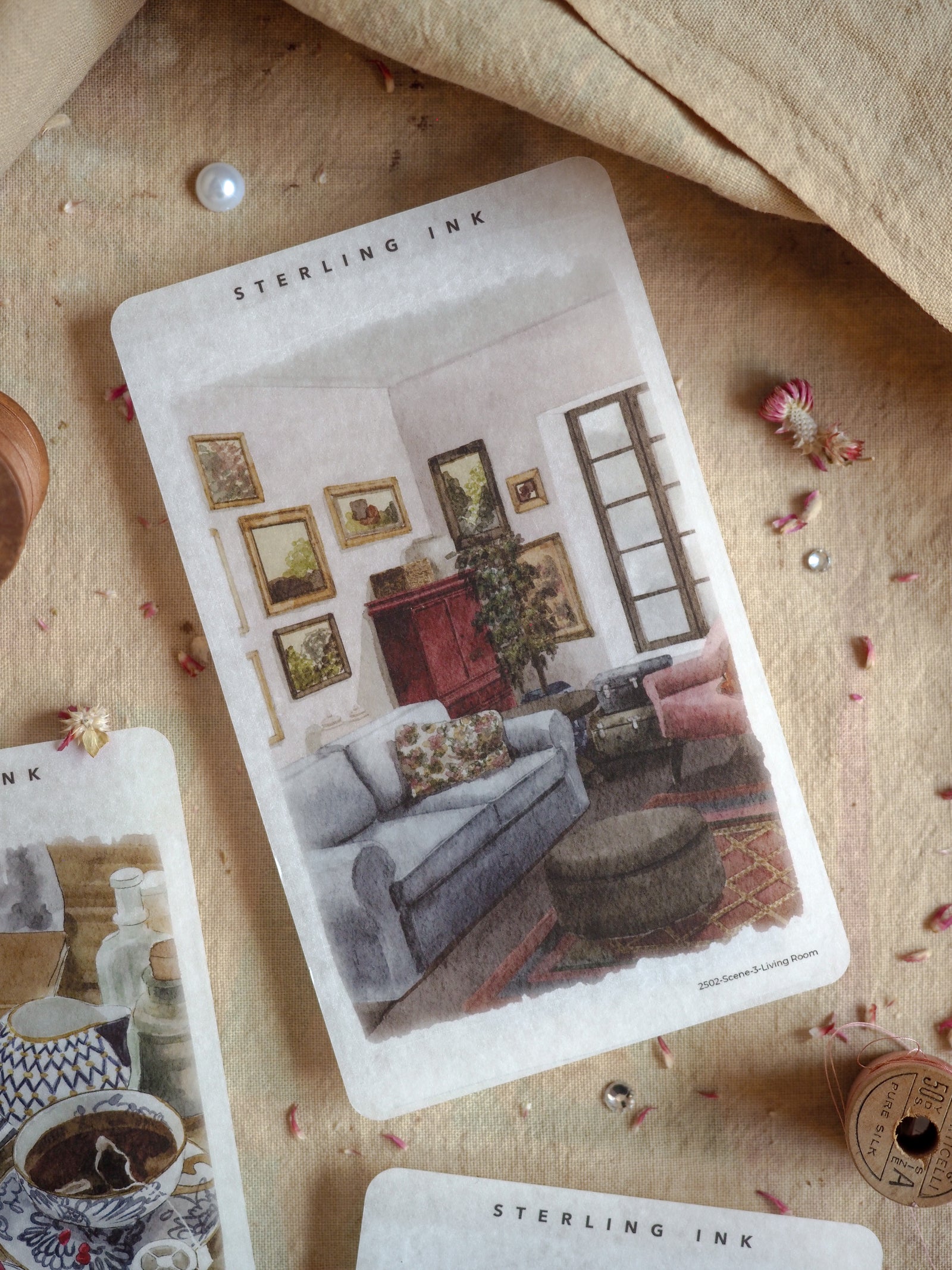 Single scene sticker sheet featuring a cozy illustration of a decorated living room, complete with framed art, shelving, and comfortable furniture.