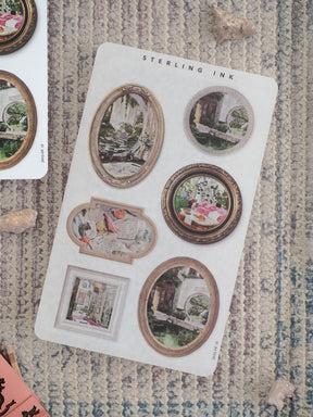 A decorative collection of aged, sepia-toned picture frame stickers for scrapbooking, featuring various circular and rectangular vintage scenes.