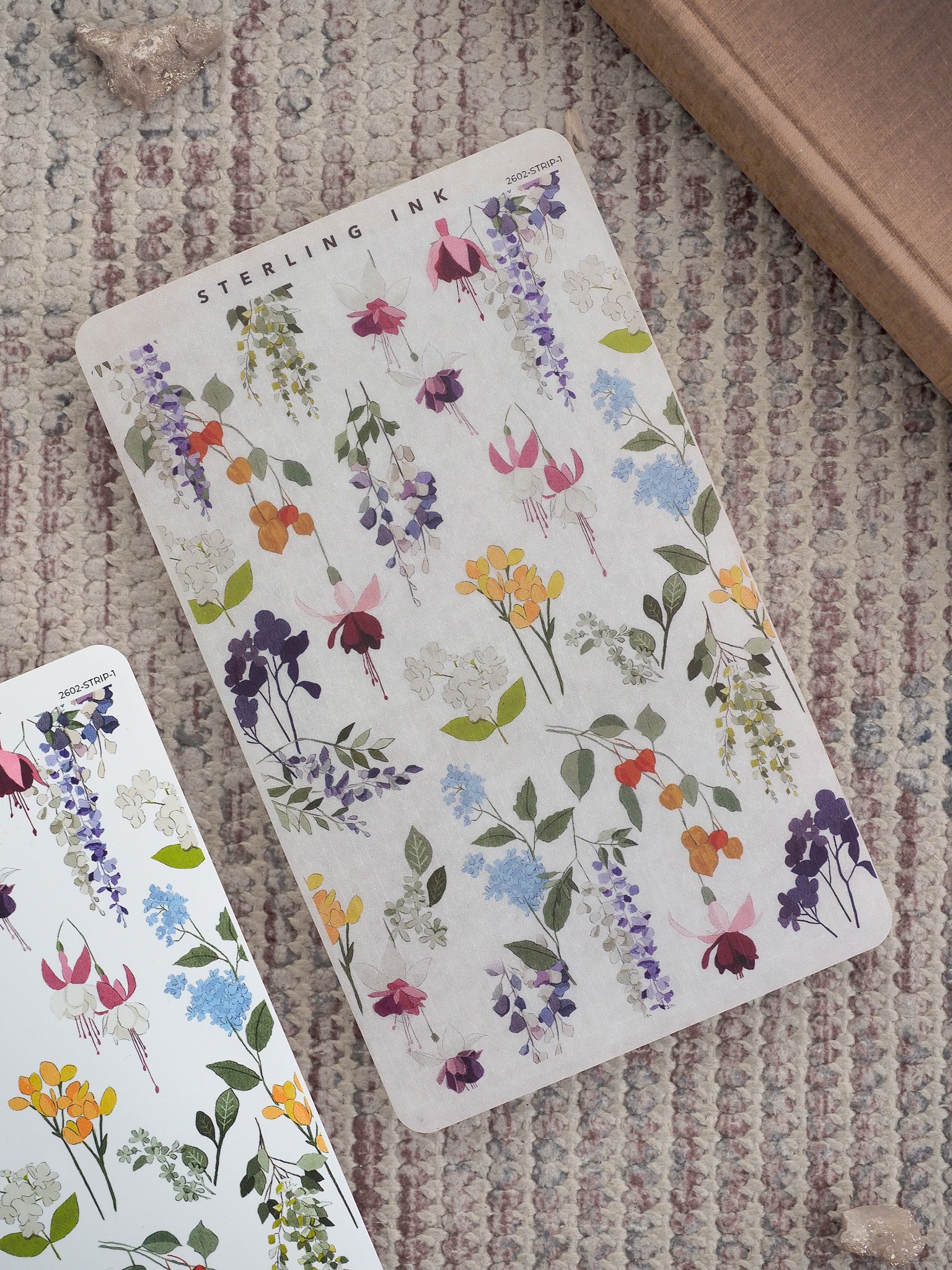 Watercolor-style thin strip stickers patterned with blooming purple, yellow, and pink wildflowers, perfect for journaling and planners.