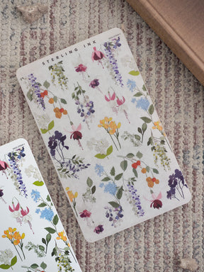 Watercolor-style thin strip stickers patterned with blooming purple, yellow, and pink wildflowers, perfect for journaling and planners.