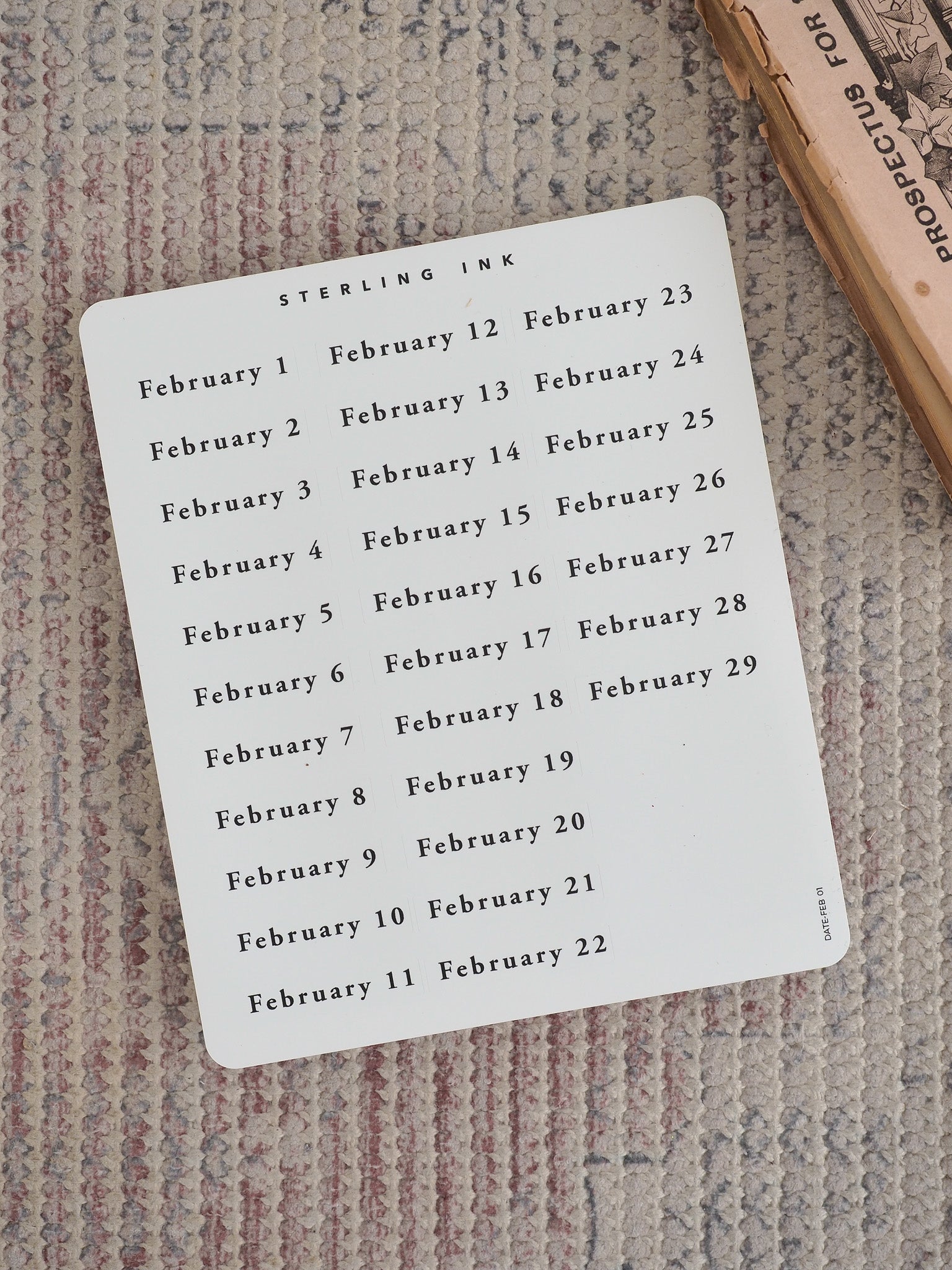 Clean white sticker sheet featuring a structured, two-column list of sequential dates from February 1 through February 22, printed clearly in sharp black ink.