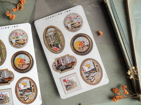 Miniature, collage-style picture frame stickers with sepia-toned designs featuring vintage urban landscapes and cozy interior scenes.