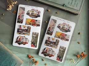 Sheet of collage-style stickers featuring detailed, distressed "torn paper" illustrations of vintage city architecture and cozy interior vignettes by Sterling Ink.
