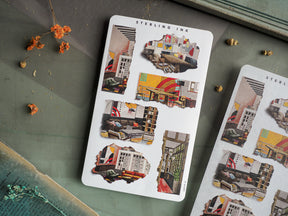 Vibrant, collage-style sticker sheets featuring detailed, layered illustrations of diverse architectural subjects, including colorful streetscapes and urban building scenes.