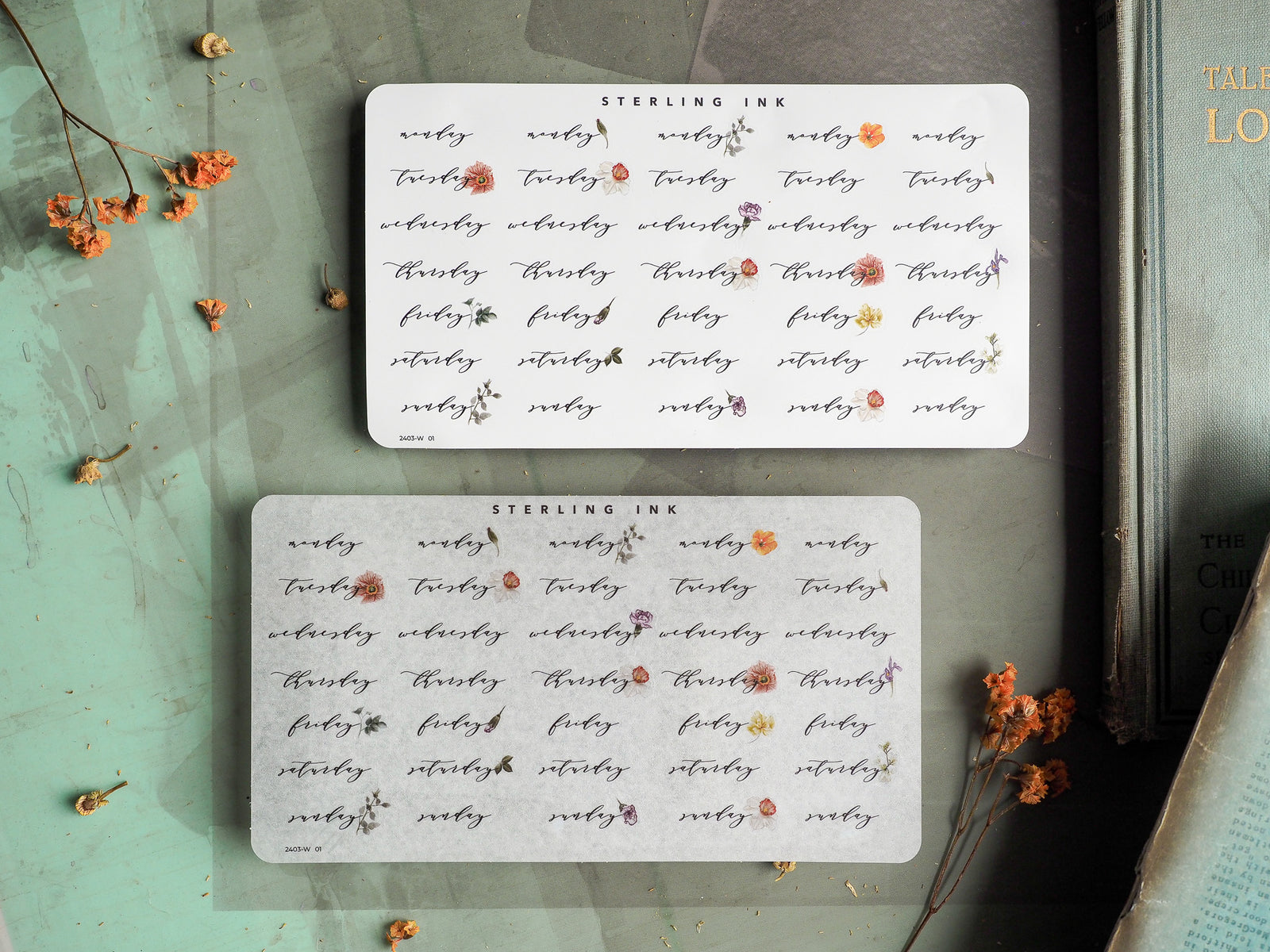 White, rectangular planner stickers featuring a delicate, repeating pattern of small, brown and blush floral elements and the branding "STERLING INK."