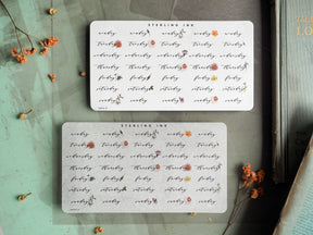 White, rectangular planner stickers featuring a delicate, repeating pattern of small, brown and blush floral elements and the branding "STERLING INK."