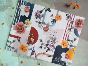 Botanical-themed stationery featuring vibrant watercolor florals, including peonies and irises, set against a modern backdrop of geometric navy, rust, and mustard blocks.