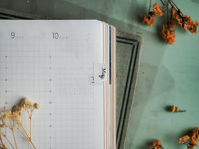 Grid planner page featuring a vertical 'March 2024' monthly tab insert, designed for organizing dates and planning appointments.