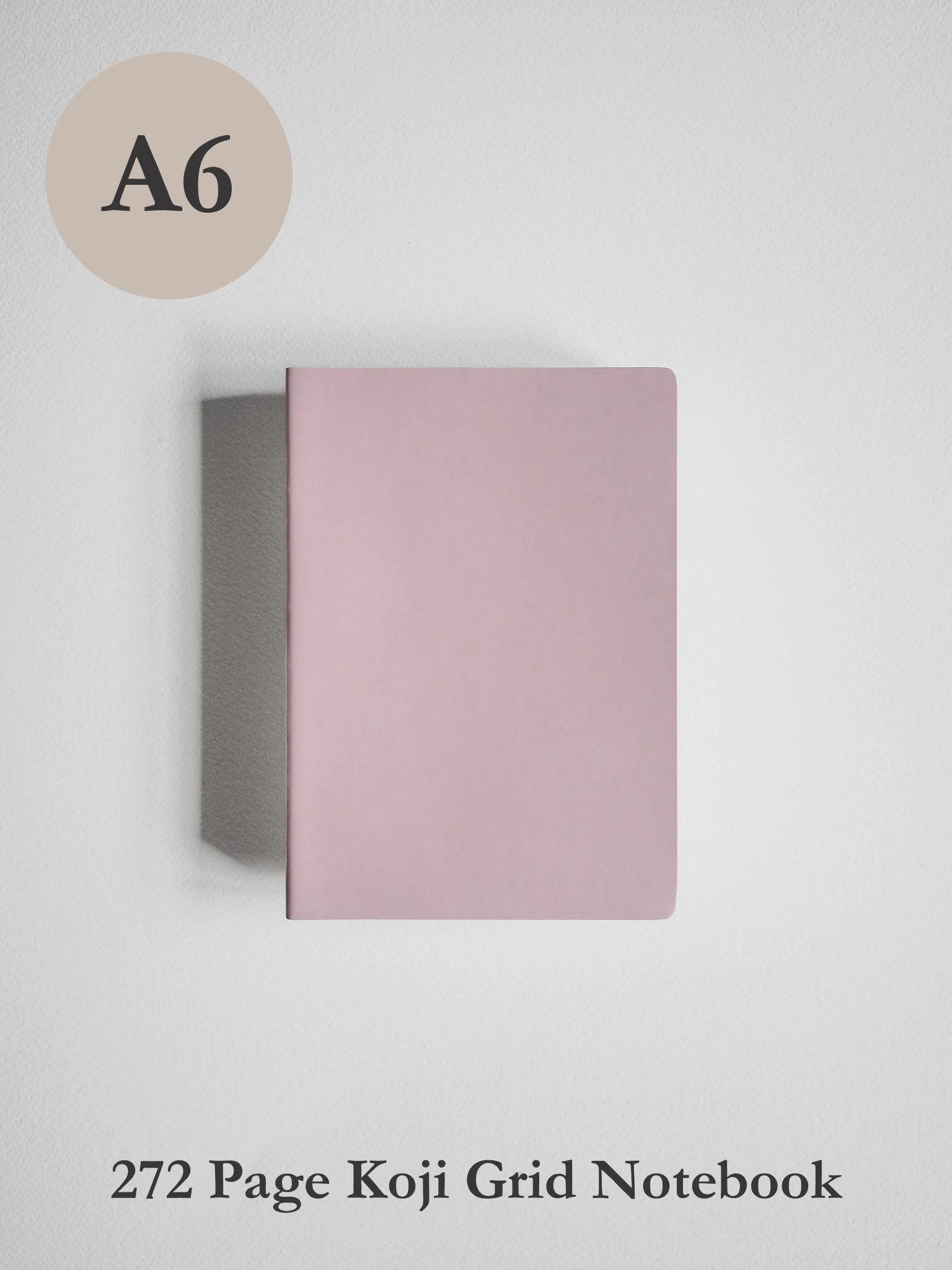A6 size 272 page koji grid notebook with a dusty pink cover, shown on a light gray background with text indicating 'A6' and '272 Page Koji Grid Notebook'.
#Color_Fairyfloss