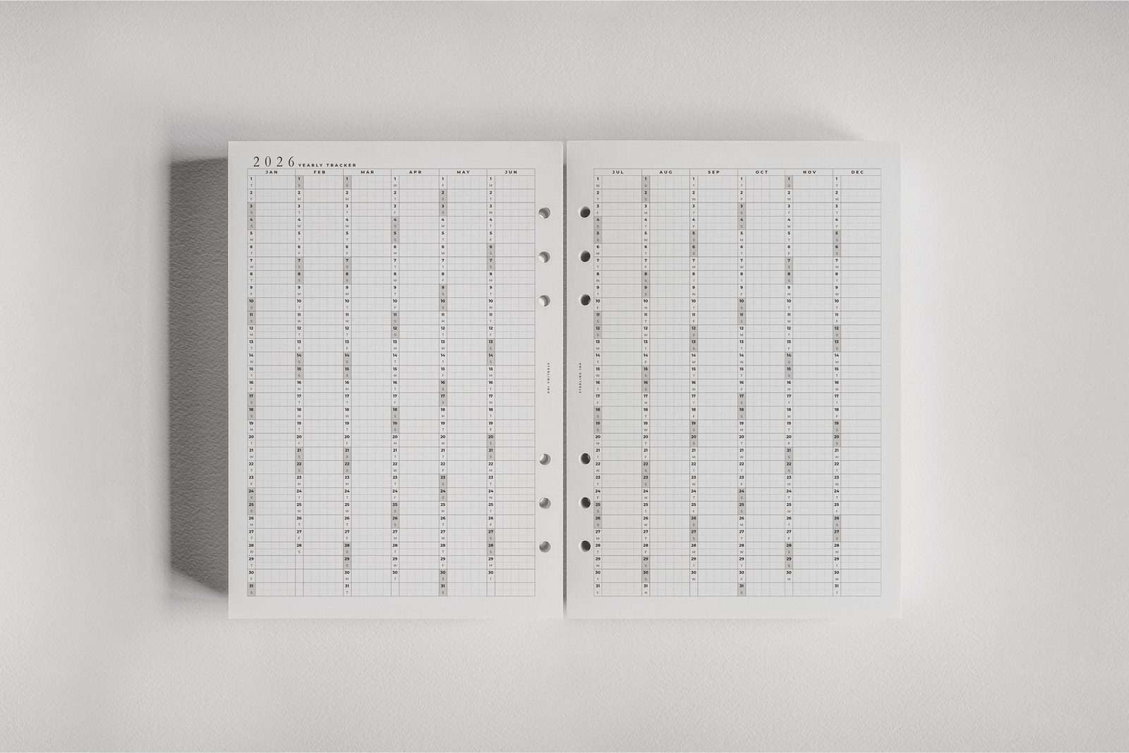 Structured monthly planner insert for 2026, featuring crisp white pages and dated grids for year-long organization.