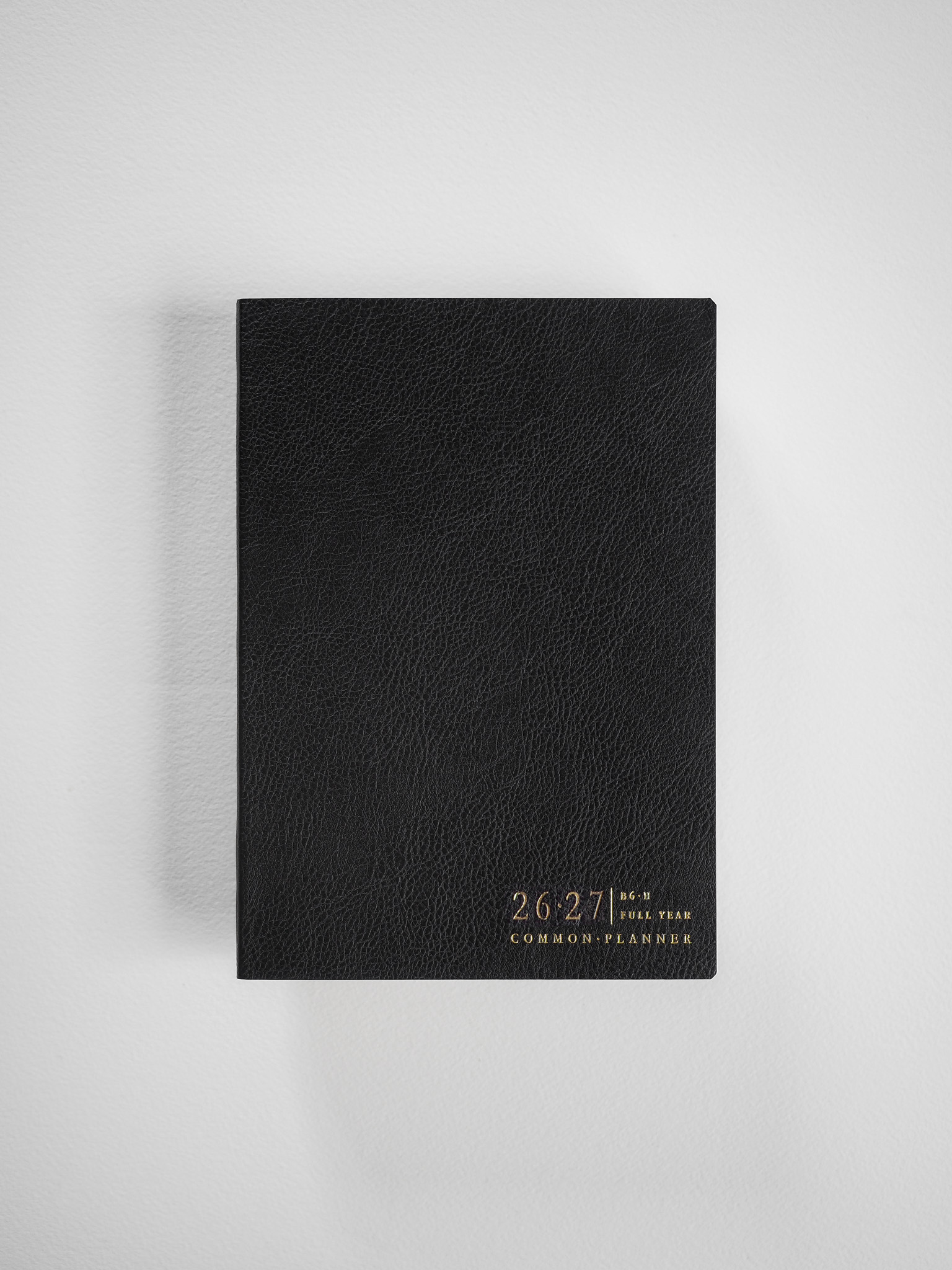 Textured black B6 academic planner for 2026-2027, featuring "Common Planner" branding and designed for a full year of academic use.