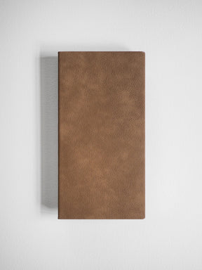 A brown faux-leather rectangular wall light or decorative panel with a textured finish, shown against a light gray background with a soft shadow.
#Color_Caramel
