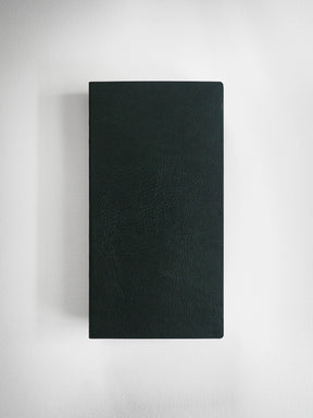 A dark green textured leather notebook or journal with a black spine, shown vertically against a light gray background.
#Color_Forest