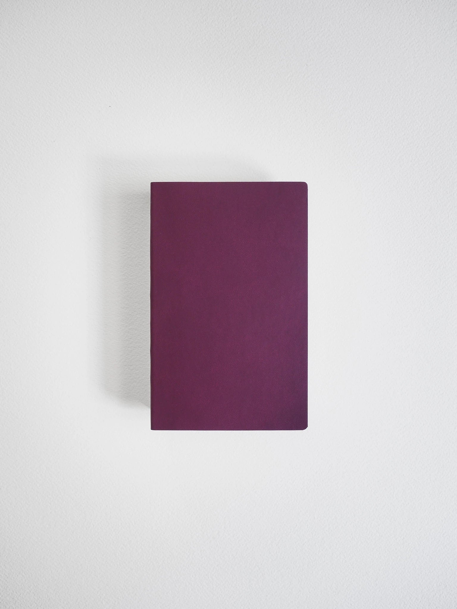 A dark purple rectangular notebook or book cover centered on a light gray background.
#Color_Mulberry
