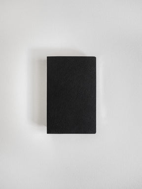 A black textured leather notebook or journal with a rectangular shape, centered on a light gray background.
#Color_Onyx