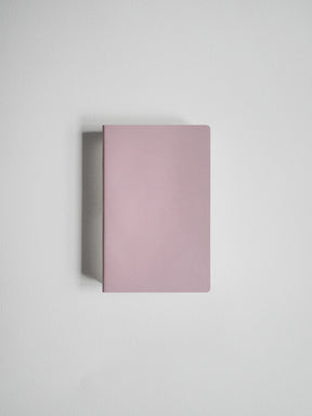 A minimalist, rectangular notebook or journal with a matte dusty pink cover, shown from a top-down perspective on a light gray background.
#Color_Fairyfloss