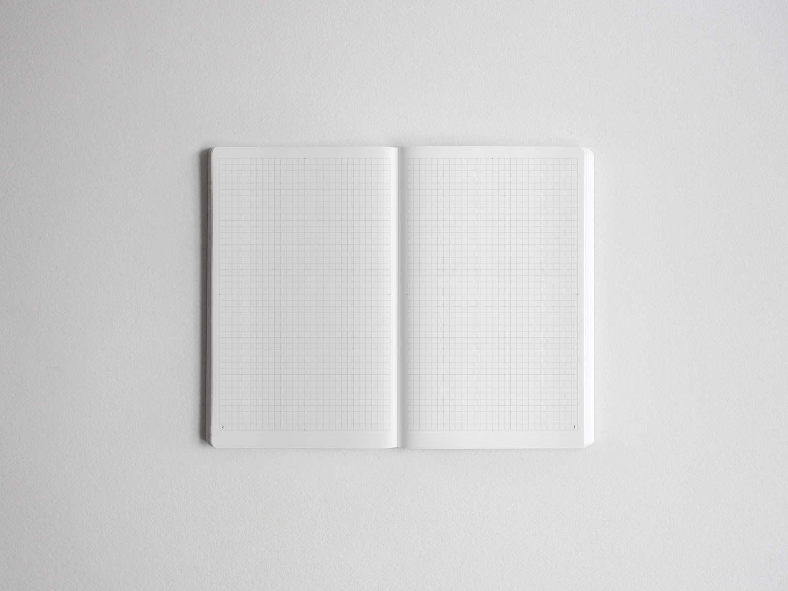 Open B6 grid notebook featuring perfectly aligned white pages with precise graph lines, ideal for detailed note-taking, drafting, or technical sketching.