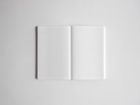 Open B6 grid notebook featuring perfectly aligned white pages with precise graph lines, ideal for detailed note-taking, drafting, or technical sketching.