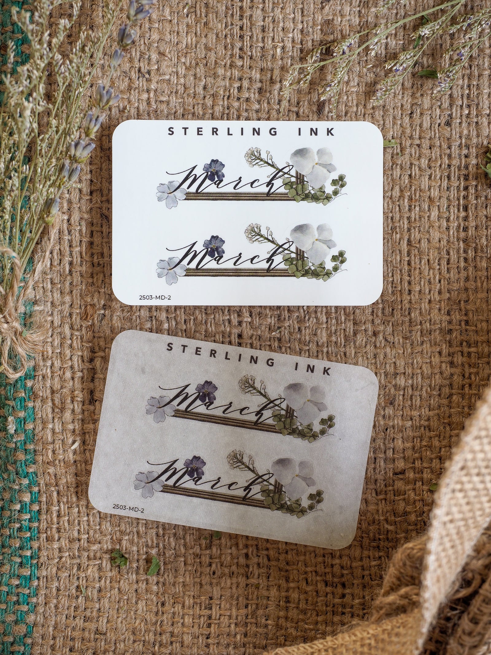 Decorative set of "March" month stickers featuring elegant watercolor florals and foliage printed on both crisp white and rustic kraft papers.