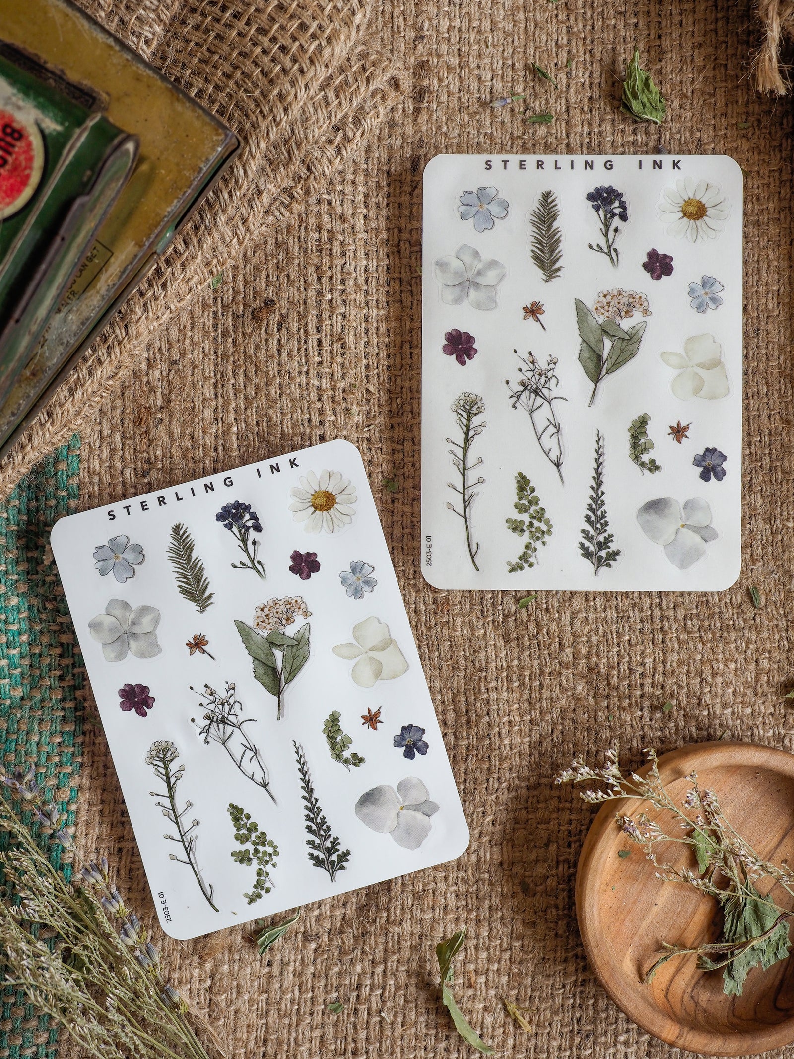 Botanical "Elements" sticker sheets featuring detailed black-and-white illustrations of diverse spring flowers, ferns, leaves, and stems.