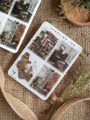 Vintage sterling ink illustration stickers in a collage style, featuring sepia-toned architectural drawings of brick buildings and window details.