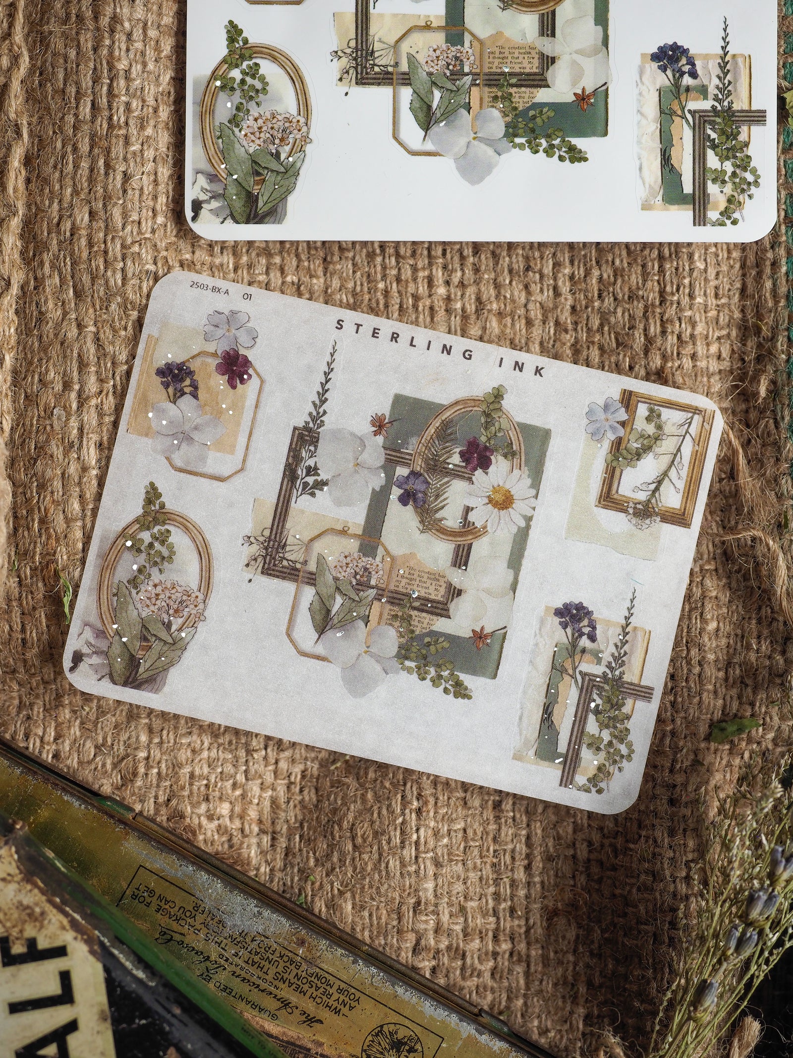 A set of delicate vintage botanical corner and edge stickers featuring silver foil accents, muted floral bouquets, and ornate scrapbook frames.