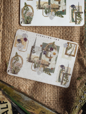 A set of delicate vintage botanical corner and edge stickers featuring silver foil accents, muted floral bouquets, and ornate scrapbook frames.