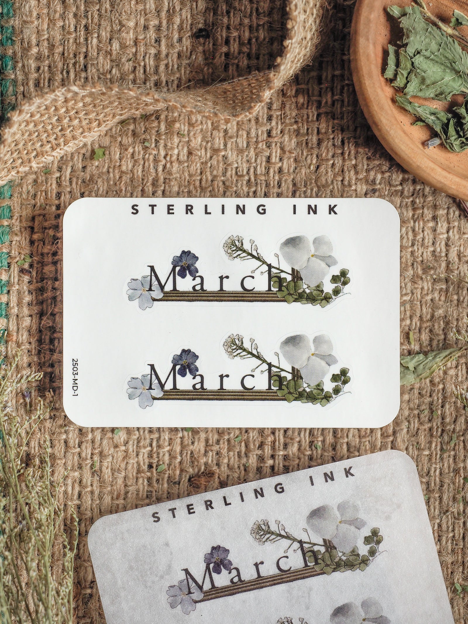 Delicate botanical planner stickers for March, featuring watercolor spring florals, soft greenery, and "March" text for seasonal journaling.