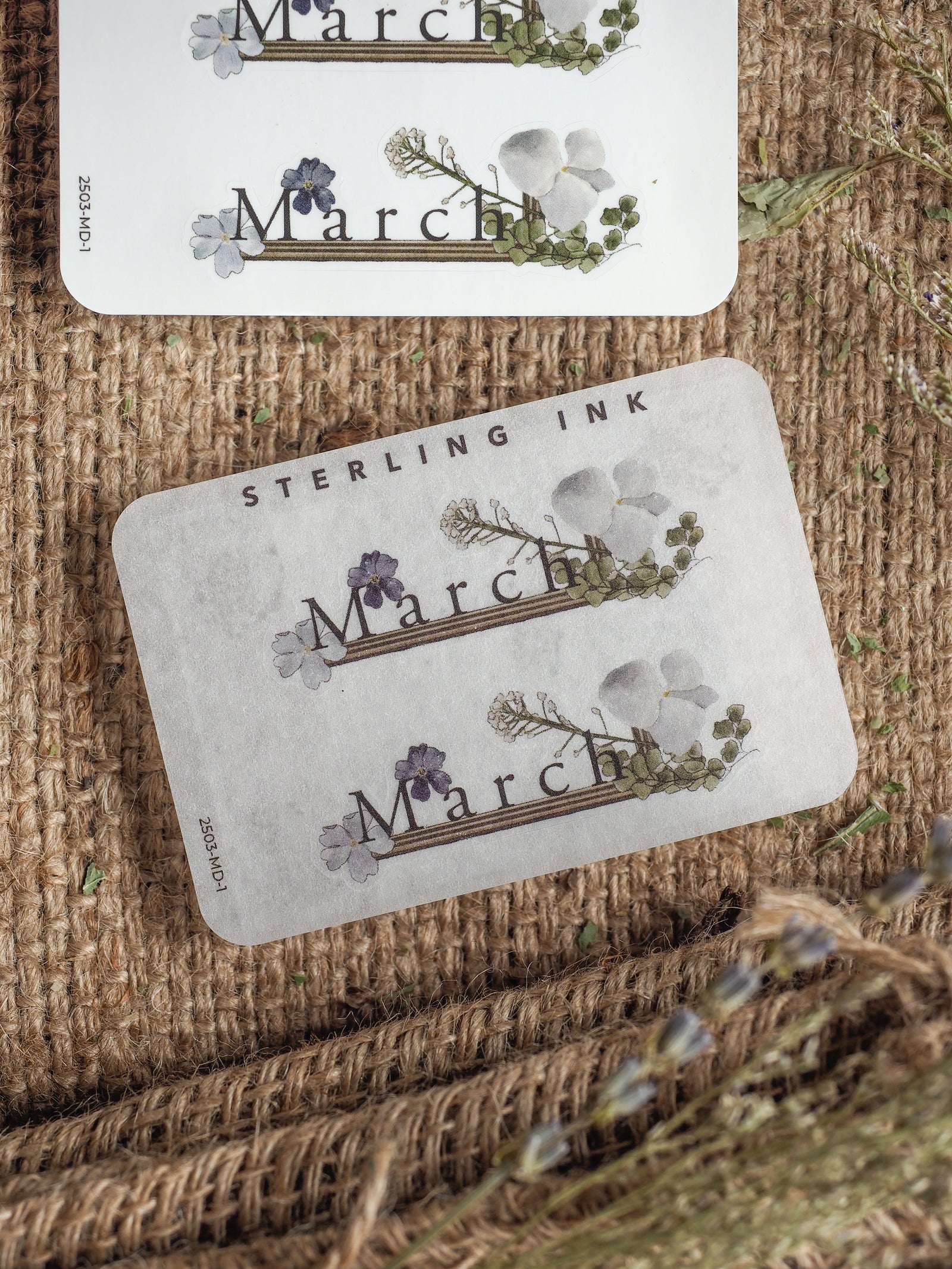 Elegant "March" month sticker featuring delicate white and pale purple watercolor florals, perfect for adding a soft spring botanical touch to any planner.