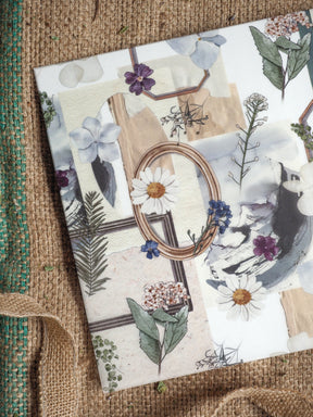 Planner cover featuring a romantic botanical collage of muted watercolor flowers, leaves, and delicate nature illustrations in pastel earth tones.