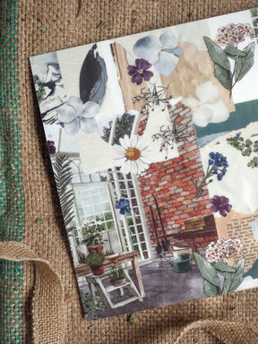 Romantic botanical print titled 'Vellum - March 2025,' showcasing soft blue florals, delicate daisies, exposed brickwork, and vintage windows.