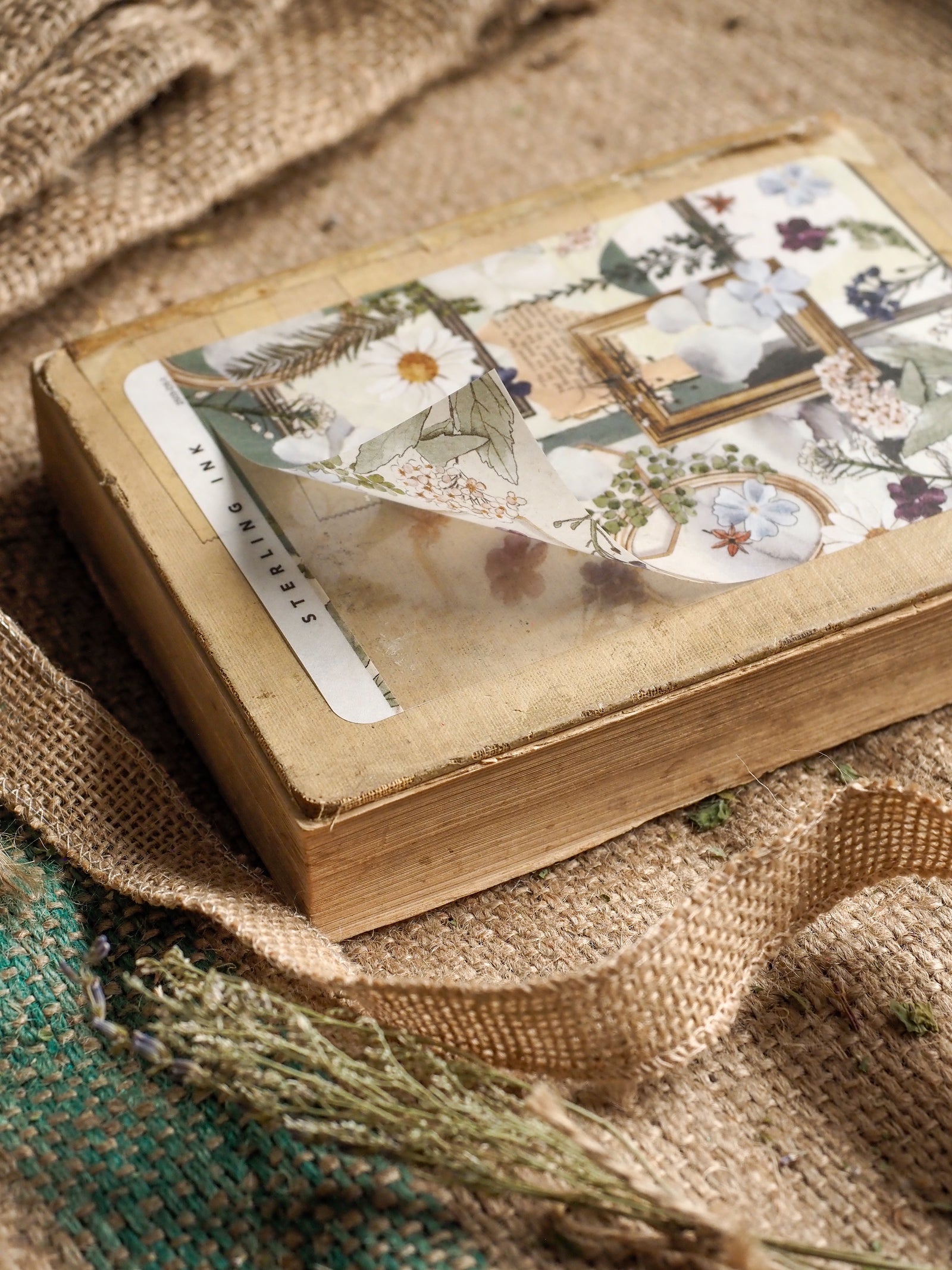 Decorative planner sheet featuring a vintage spring collage design with soft floral elements, antique picture frames, and subtle botanical details.
