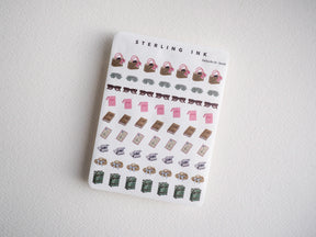 Cute daily life sticker set featuring tiny mini purses, sunglasses, books, boxes, and stacked packages. Perfect for