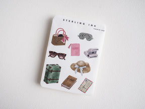 Travel sticker set featuring suitcase, passport, sun hat, sunglasses, purse, and vintage travel decals for scrapbook