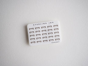 Sticker sheet with repeating black graphic pattern of stylish mini eyeglasses/specs. Ideal design for crafting decals and