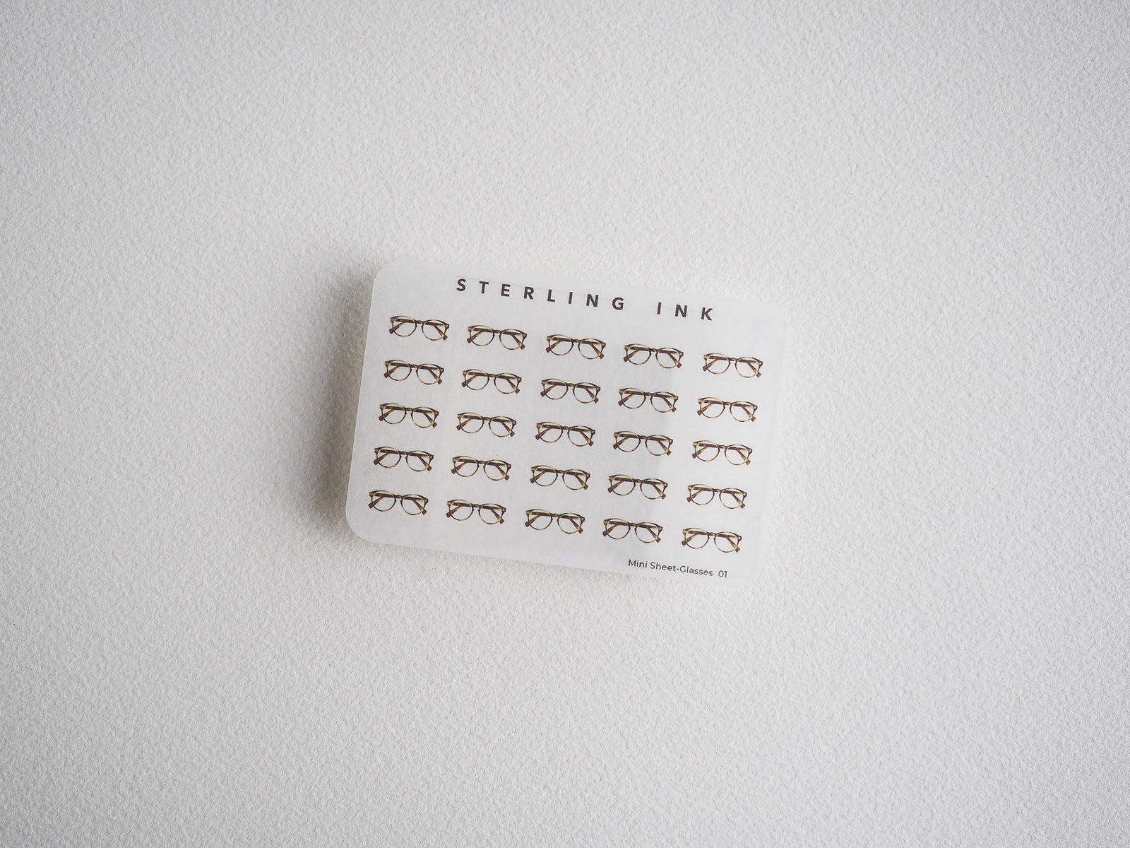 Sheet of minimalist line-art mini glasses stickers. Features repeating black line-art designs perfect for journaling,